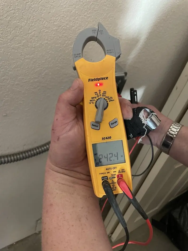 Voltage testing with clamp meter during Ceiling Fan Installation in Wayne